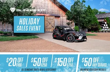 Couple walking towards Polaris Slingshot. Promotional Offer: $20 off $100, $50 off $250, $150 off $750.