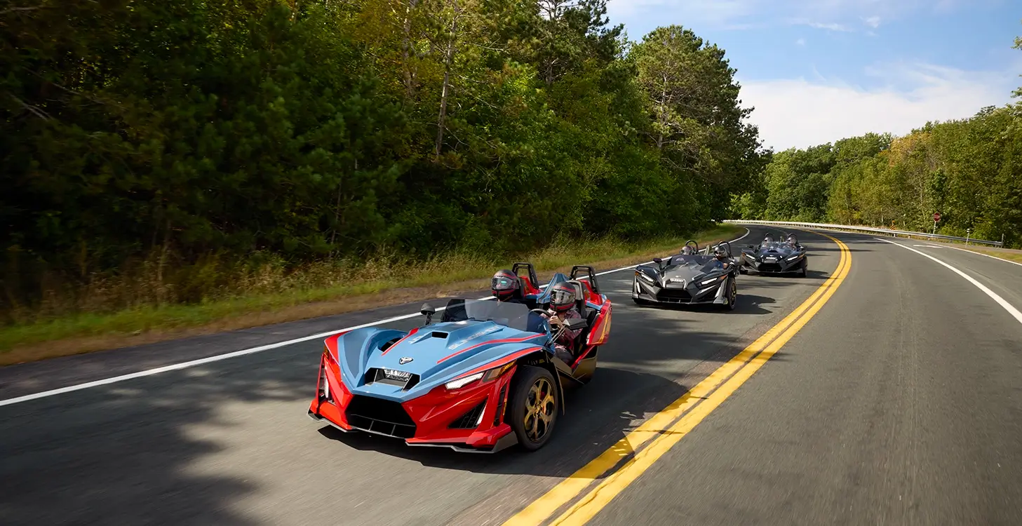 Polaris Slingshot vehicles driving down road